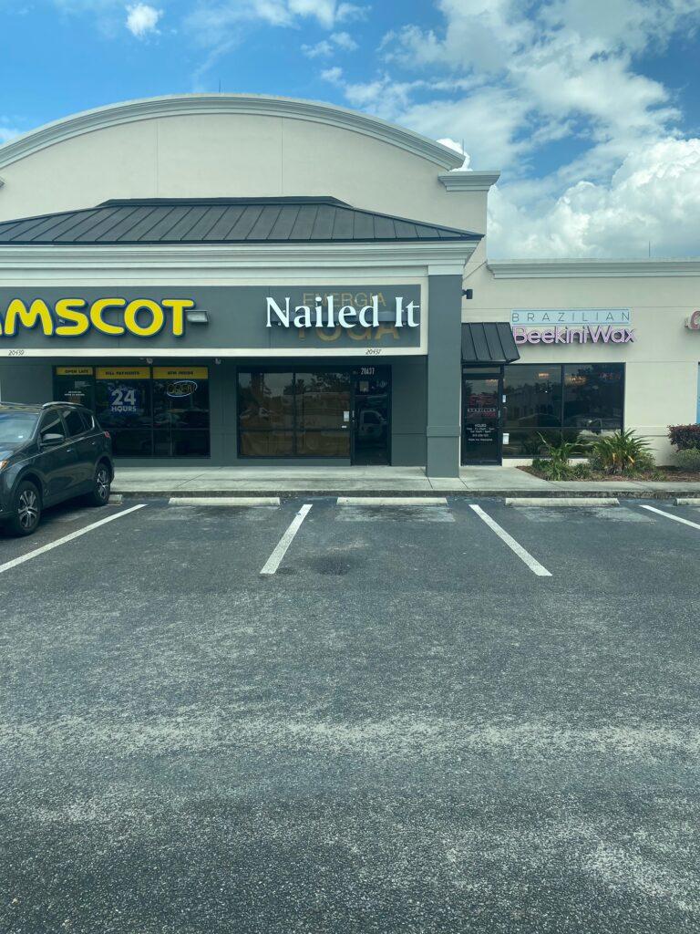 Nailed It nail salon lit channel letters on a raceway in a New Tampa strip center