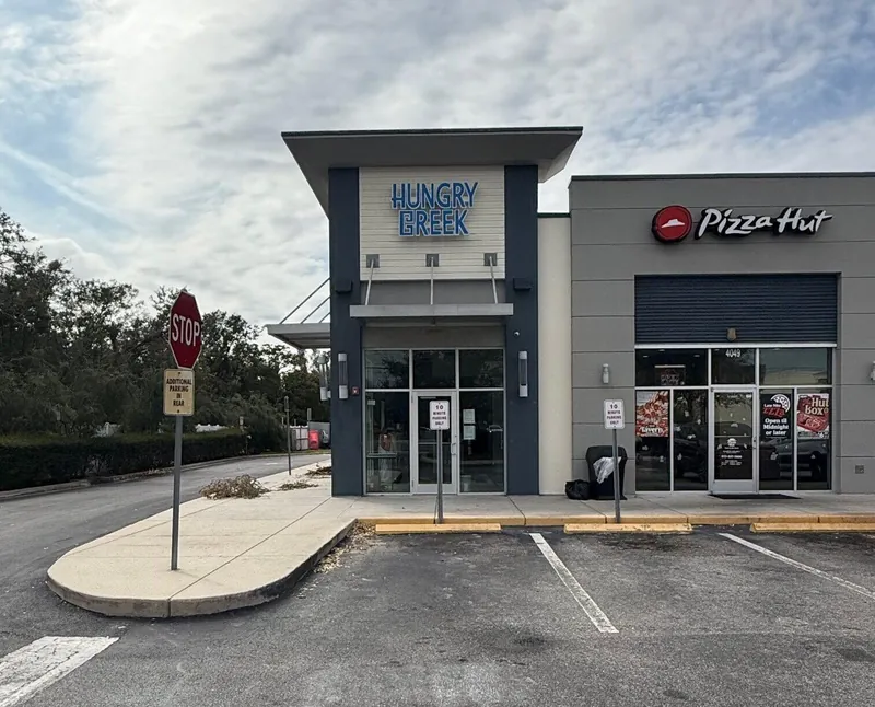 Raceway mounted illuminated channel letters installed by Quality Signs Florida